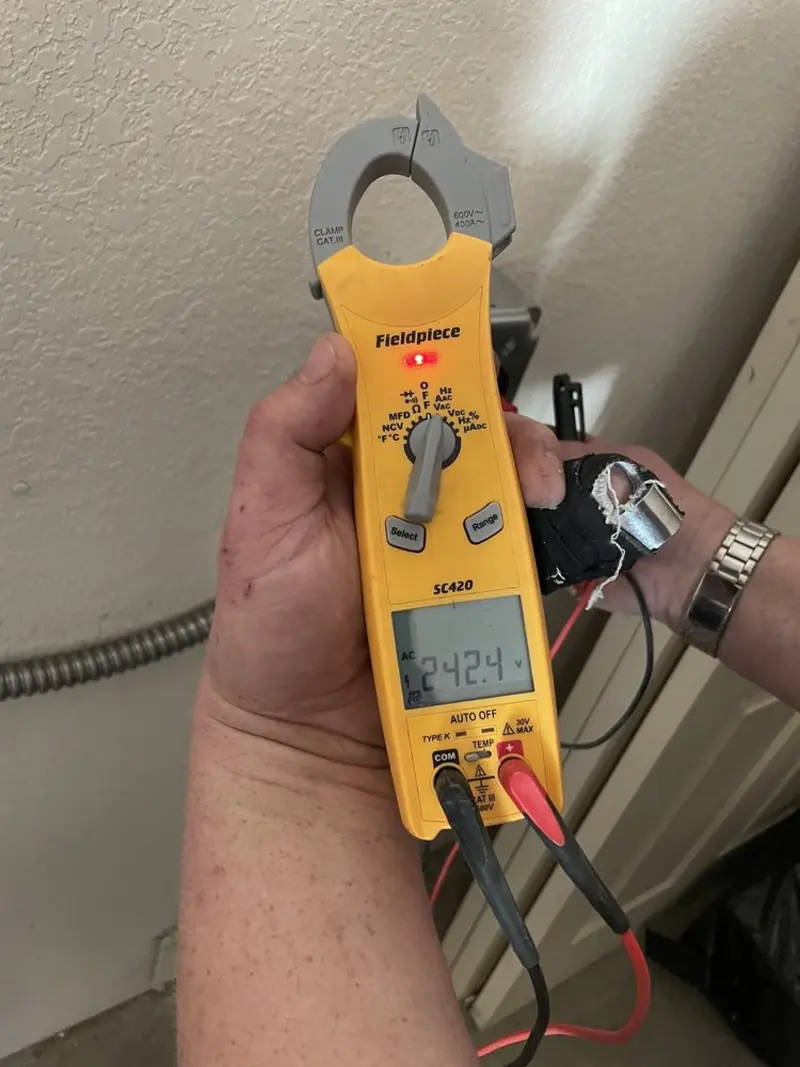 Voltage testing with clamp meter during Whole House Surge Protector in Priceville